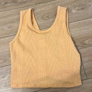Peach colored cross backed crop top